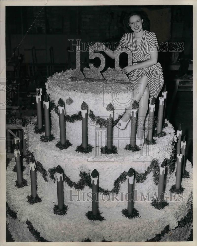 1946 Press Photo Eileen Kelly, Sesqui Queen Alternate, Sits Atop Cake, Cleveland - Historic Images