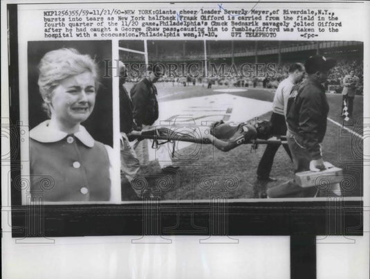 1960 Press Photo Cheerleader Beverly Meyer Cries As Giant Gifford Carried Off - Historic Images