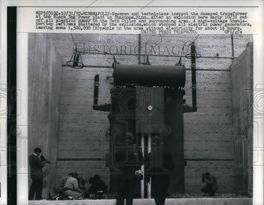 1957 Press Photo Newsman and Technician inspect damaged at Black Dog Power. - Historic Images