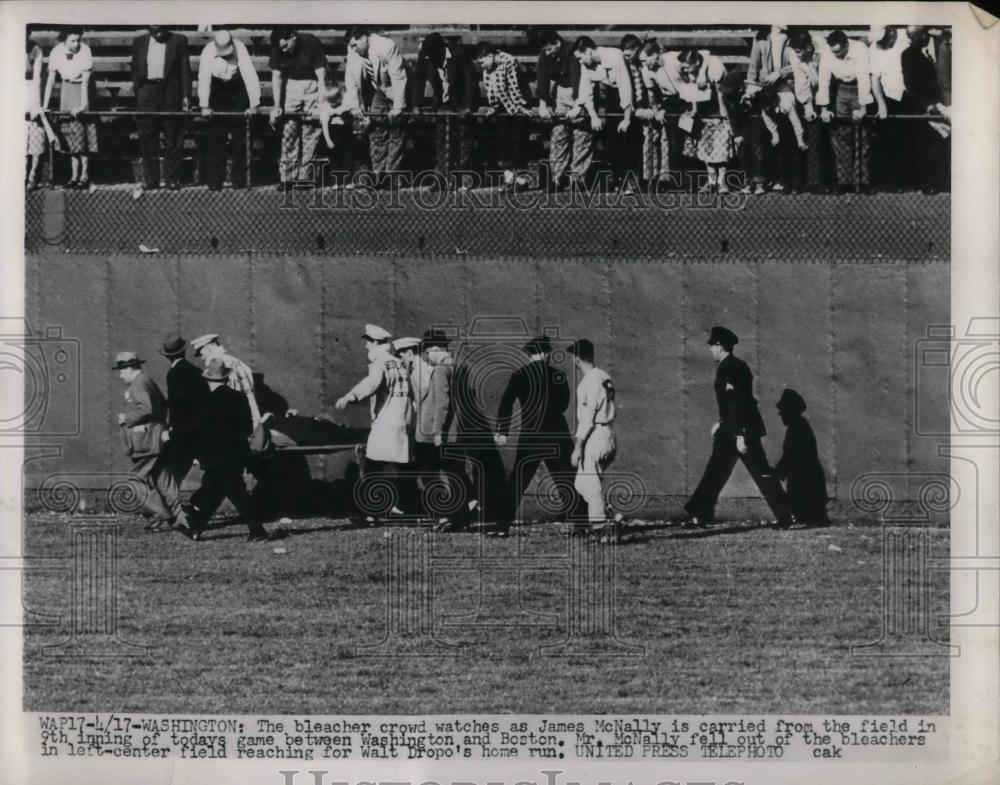1952 Press Photo James McNally carried from field Washington Boston - nea20600 - Historic Images