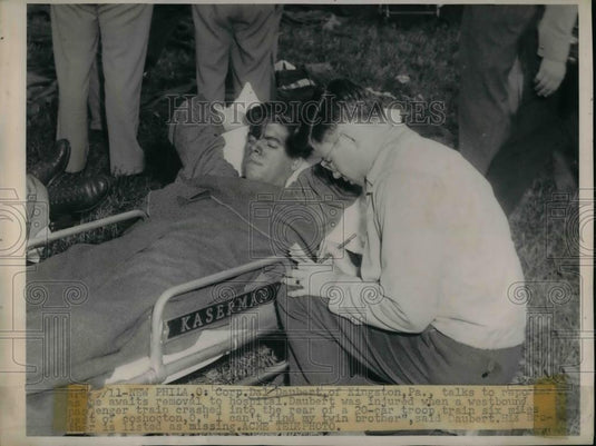 Press Photo Corp. Dai Daubert removal to Hospital injury train crash - nea32584 - Historic Images