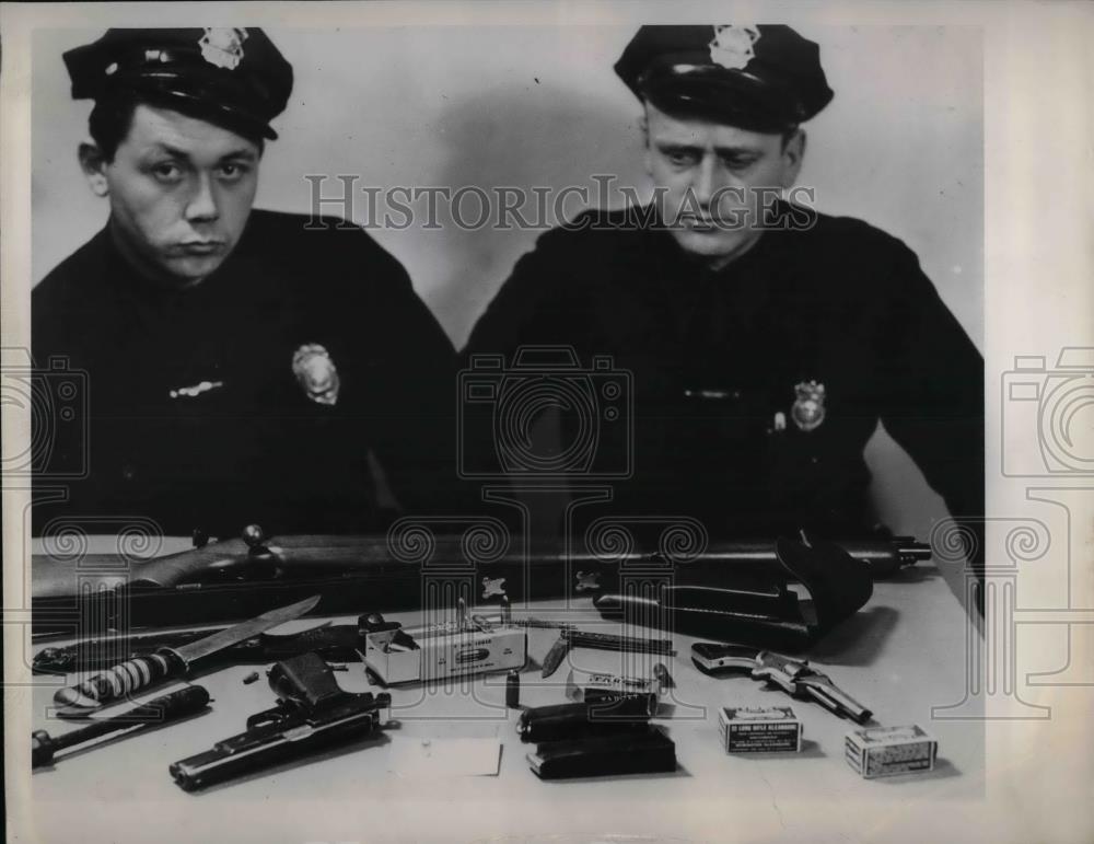 1948 Press Photo two policemen with seized weapons from criminals - nea33733 - Historic Images