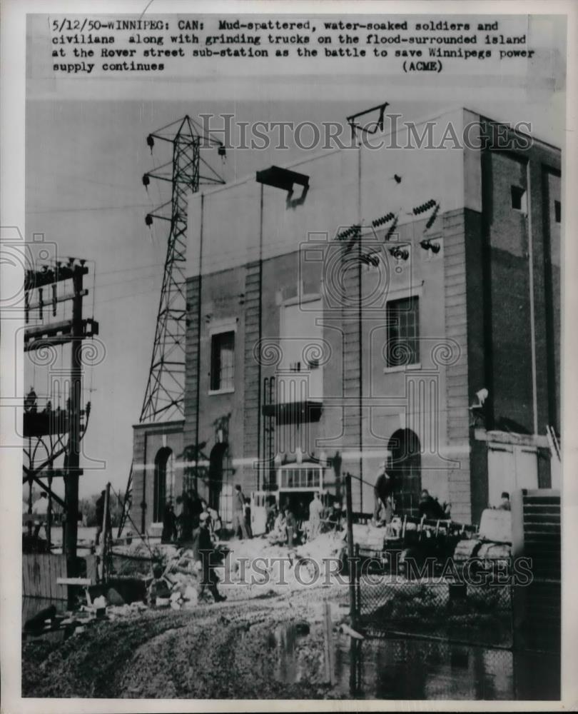 1950 Press Photo Flood surrounded at the Rever st. Sub-station at Winnepeg Power - Historic Images