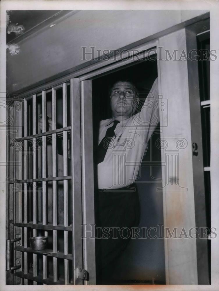 1956 Press Photo Police deputy John Dybzinski checks jail cell door - nea30039 - Historic Images