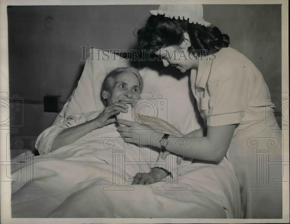 1945 Press Photo Josephine Sartoria attended by nurse Eunice Schoffler at the - Historic Images