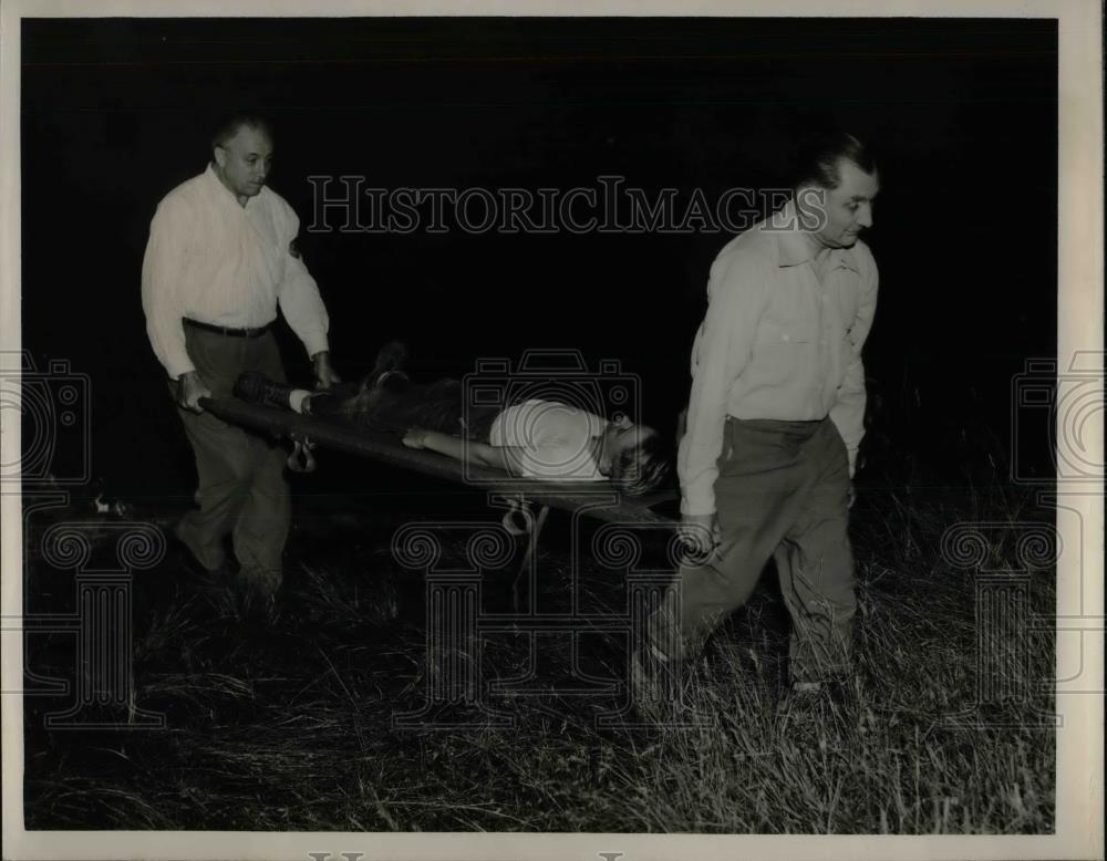 1950 Press Photo Rescue workers carry Bob Lansell from a fire scene - nea37377 - Historic Images