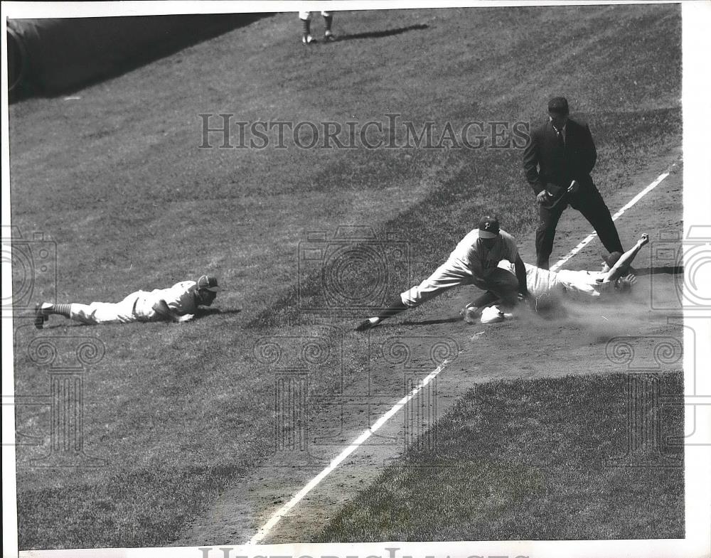 1957 Press Photo Cubs Coach George Myatt on Ground to Watch Play at Third Base - Historic Images