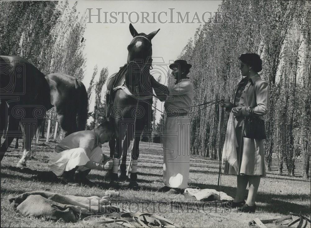 Press Photo Gaucho boys prepare horses for the Argentine Duck Game - Historic Images