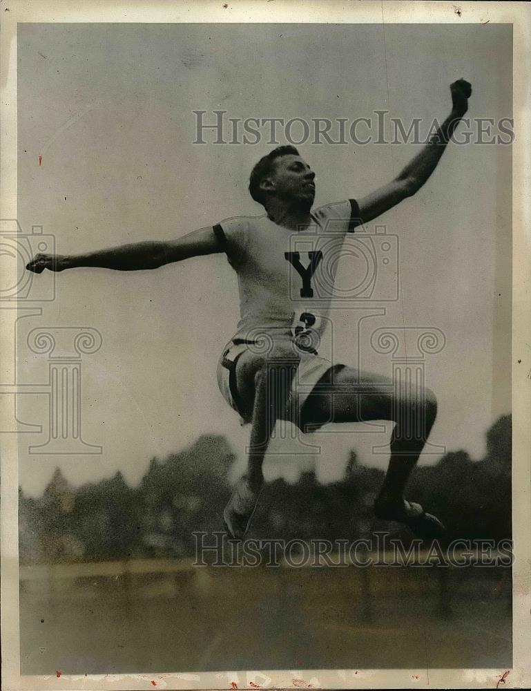 1927 Press Photo G. P. Dacon performing broad jump at competition - Historic Images