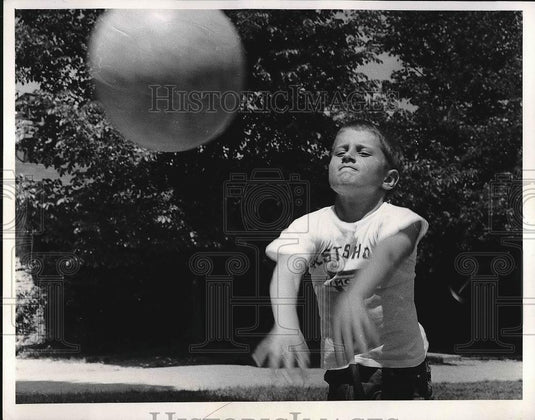 1959 Press Photo Young boy playing with a ball - nea55632 - Historic Images