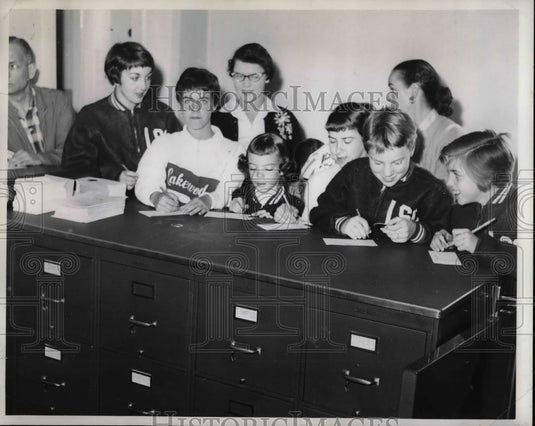 1959 Press Photo Children Sign Up For Family Swimming Tags - nea57953 - Historic Images