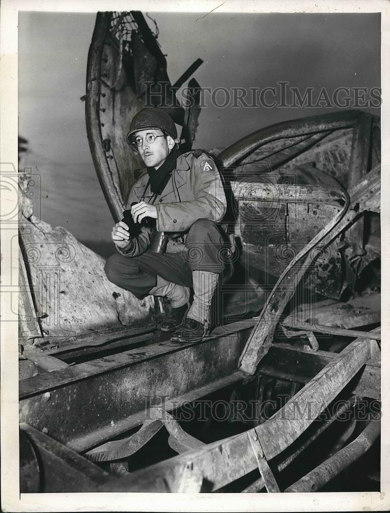 1944 Press Photo Tom Wolf standing atop wreckage - nea69077 - Historic Images