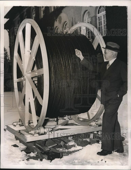 1939 Press Photo Dr. Charles Pigot examining steel rope - nea71905 - Historic Images