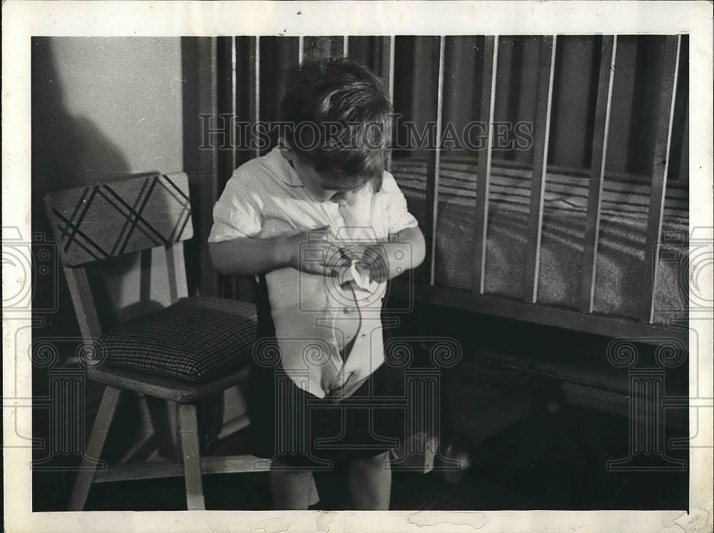 1938 Press Photo A young boy getting ready for bed - Historic Images