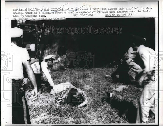 1959 Press Photo Fireman Escapes Gasoline Storage Station Explosion, Kansas City - Historic Images