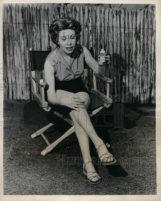 1958 Press Photo Housewife Applying Insect Repellent Lotion - nea82461 - Historic Images