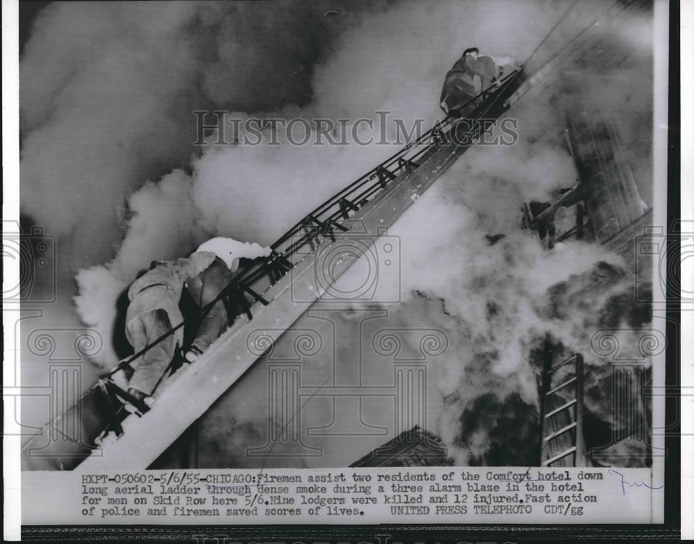 1955 Press Photo Firemen assisting residents of comfort Hotel - nea89721 - Historic Images