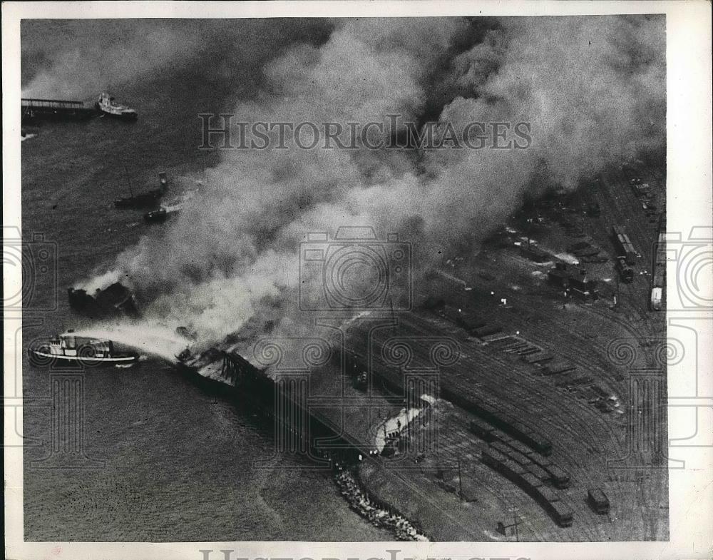 1949 Press Photo Burning Coal Barges towed out into the Bay by Fireboats in N.Y - Historic Images