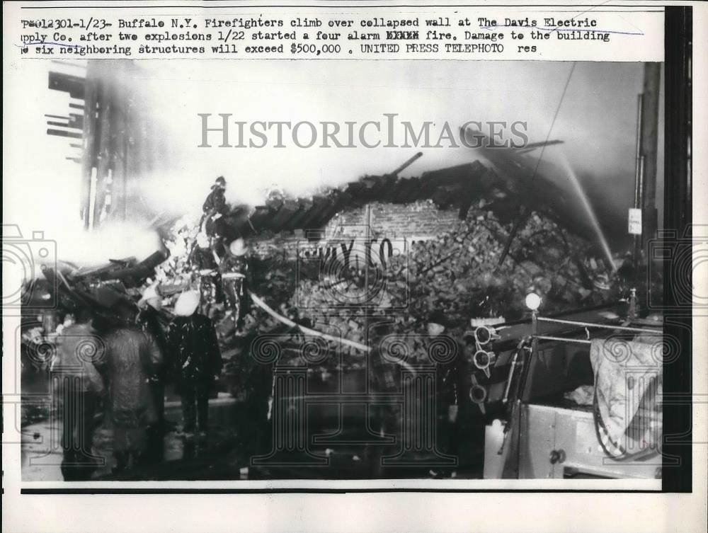 1957 Press Photo Firefighters Climb Over Collapsed Wall Of Electric Company - Historic Images