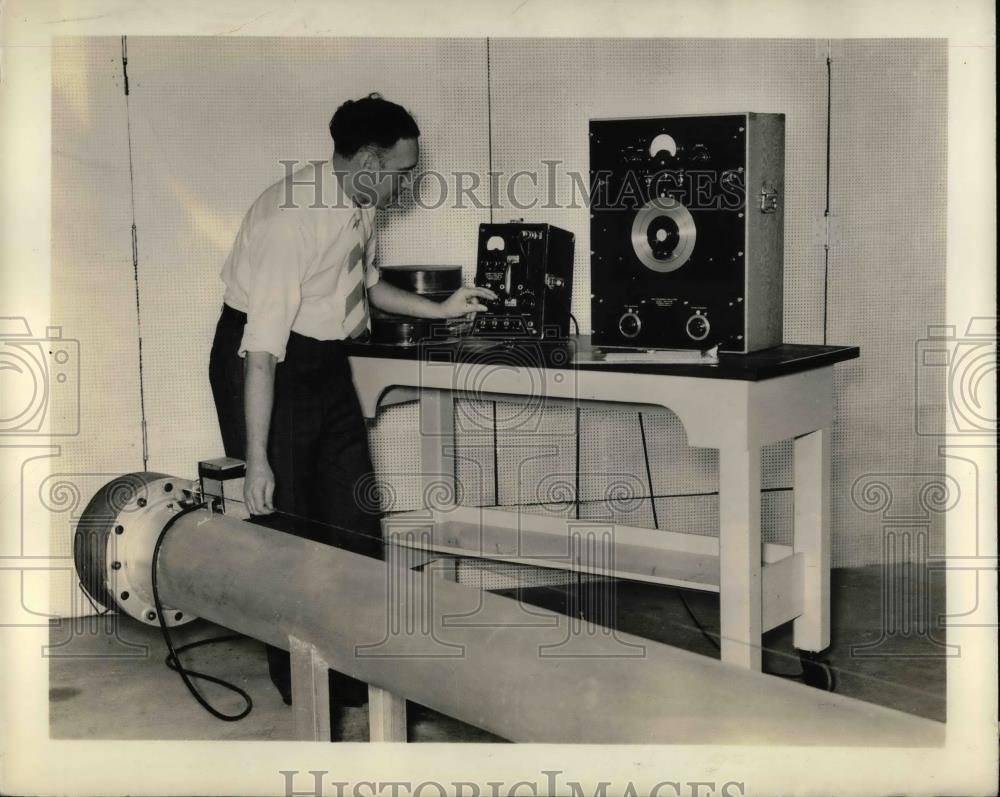 1937 Press Photo Testing insulating material in lab - nea70705 - Historic Images