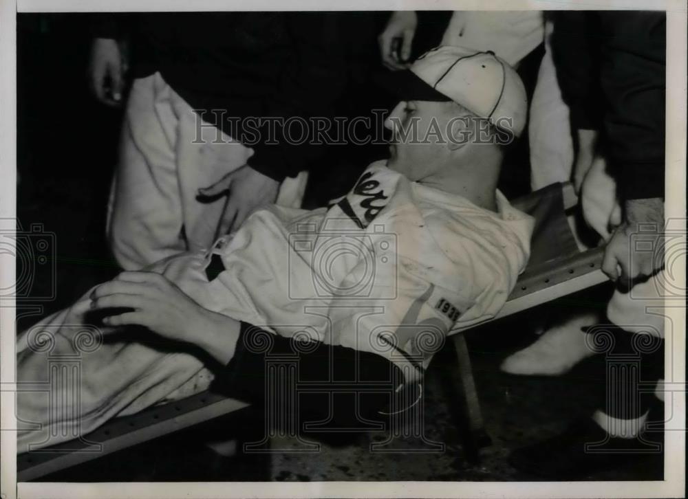 1938 Press Photo Injured Dodger Pitcher Forrest Pressnell Carried Off of Field - Historic Images