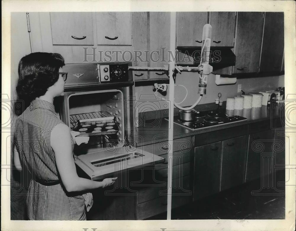 1962 Press Photo Woman Using New Gadget in Kitchen - nea83530 - Historic Images