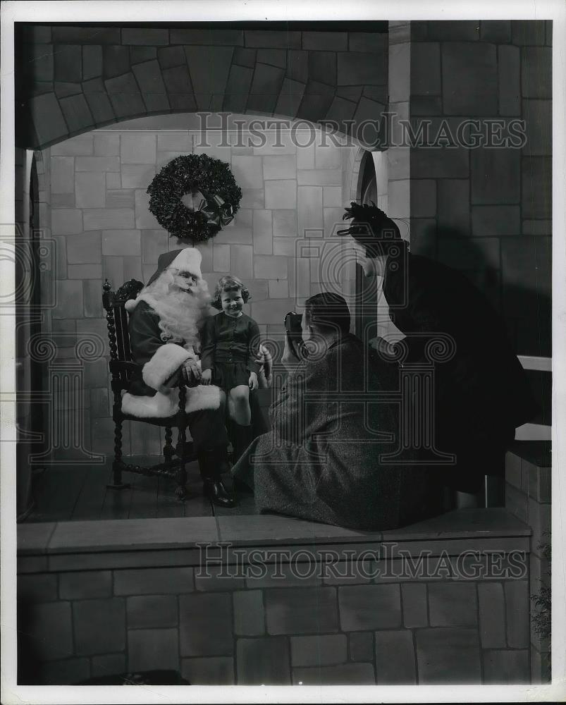 1963 Press Photo Child on Santa&#39;s Lap Being Photographed by Parents - Historic Images