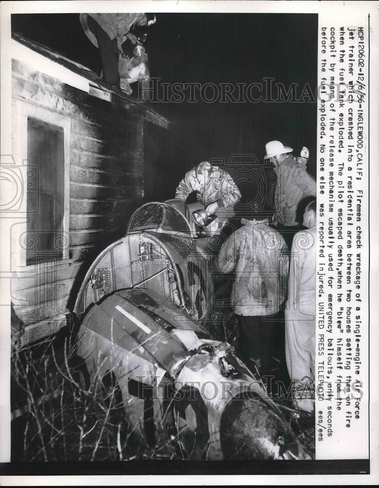 1957 Press Photo Firemen checking Air Force Jet Trainer - Historic Images