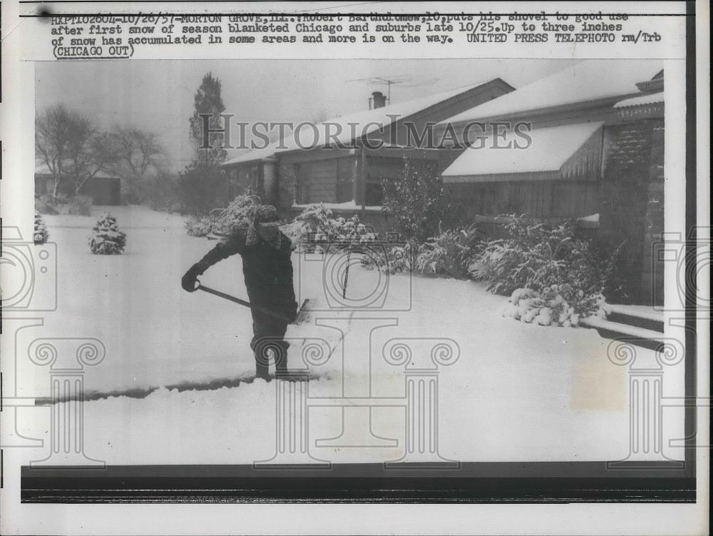 1957 Press Photo Robert Bartholomew shovels the sidewalk in Morton Grove, Ill. - Historic Images