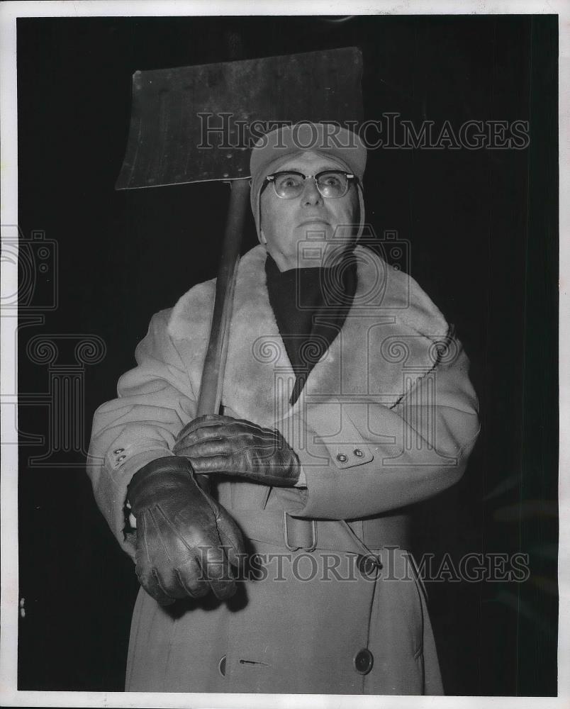 1958 Press Photo Claire W.Schuneman of Scottsbluff holds a Snow Shovel. - Historic Images