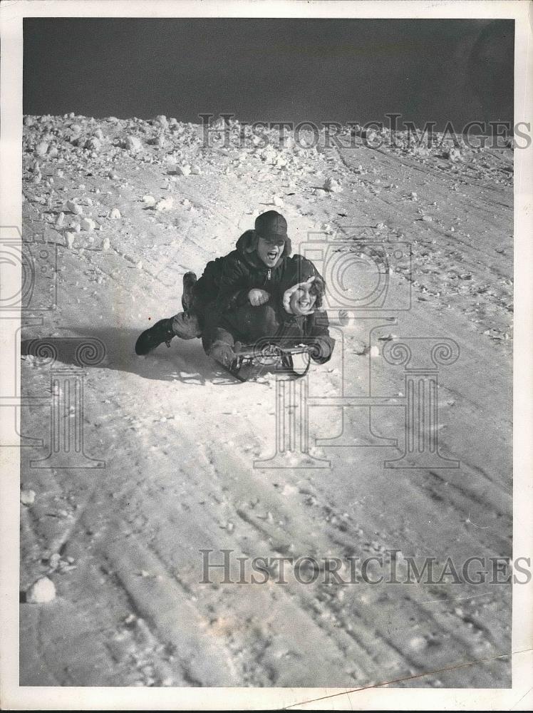 1959 Press Photo Kenny and Karen Icke Sledding Down Snow Covered Hill - Historic Images