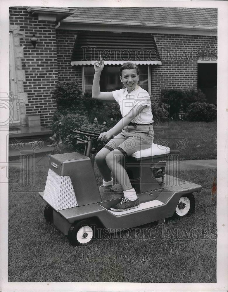 1957 Press Photo Carol Hemp Tries out the Bolens Rotary Mower by Bradley Supply - Historic Images