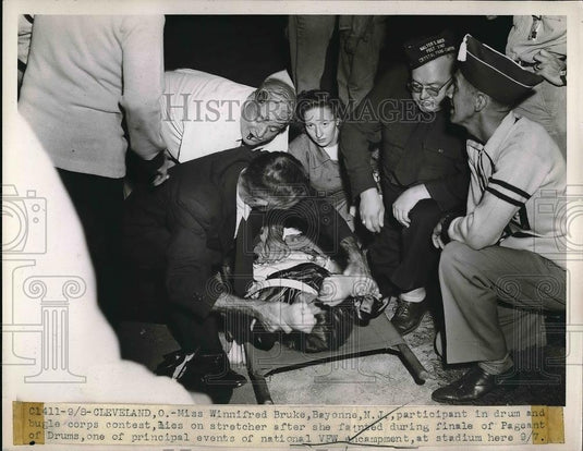 1947 Press Photo Miss Winnifred Bruke Faints During Finale of Pageant of Drums - Historic Images