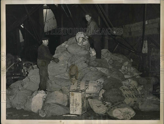 1937 Press Photo Mail clerks stacking mail bags on Pier 59 to be loaded on the - Historic Images