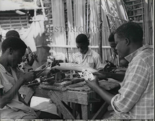 1966 Press Photo Native Artists living in Luanda Angola's Capital carving Ivory - Historic Images