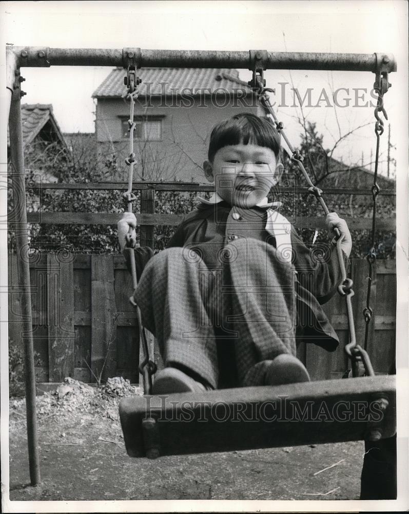 1958 Press Photo A Japanese youngster swinging high &amp; low - Historic Images