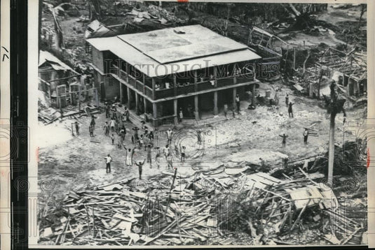 1963 Press Photo Haitian survivors of Hurricane Flora wave over the Plane. - Historic Images