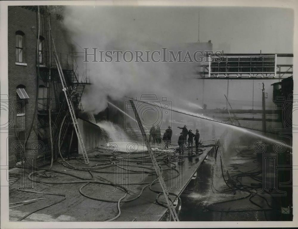 1937 Press Photo Firefighters fighting a fire - Historic Images