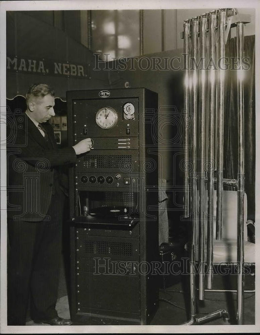 1937 Press Photo Charles Jack working the controls of a transmitter used to send - Historic Images
