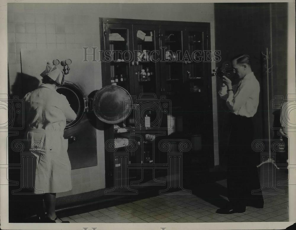 1931 Press Photo filming of equipment sterilization process at a hospital - Historic Images