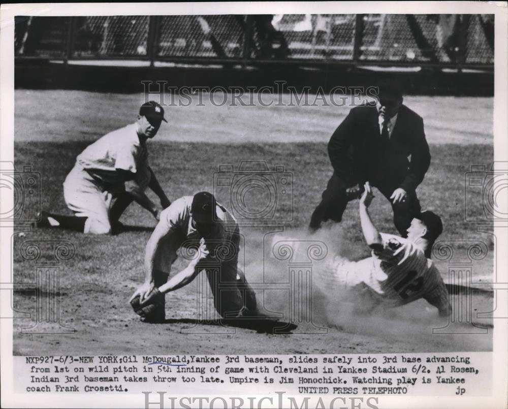 Press Photo Yankees Gil McDougald slide safe of game with Cleveland. - Historic Images