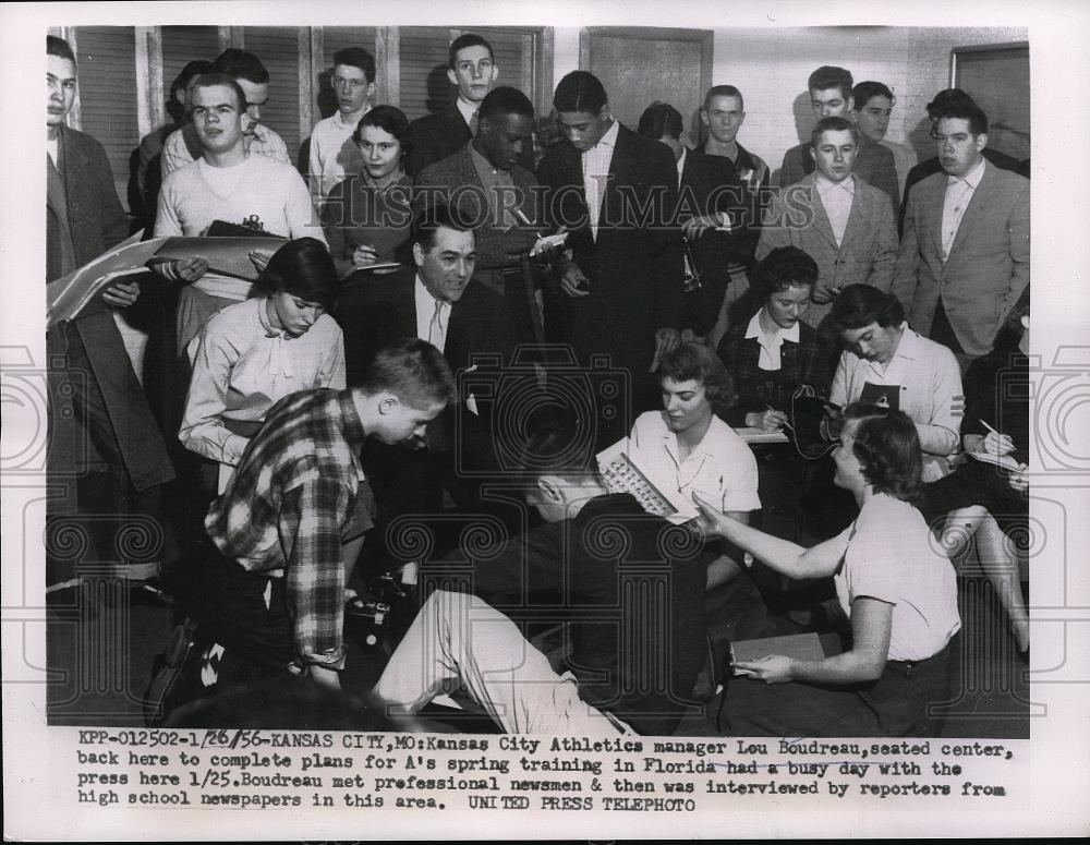 1956 Press Photo Lou Boudreau interviewed by newsmen &amp; high school reporters - Historic Images