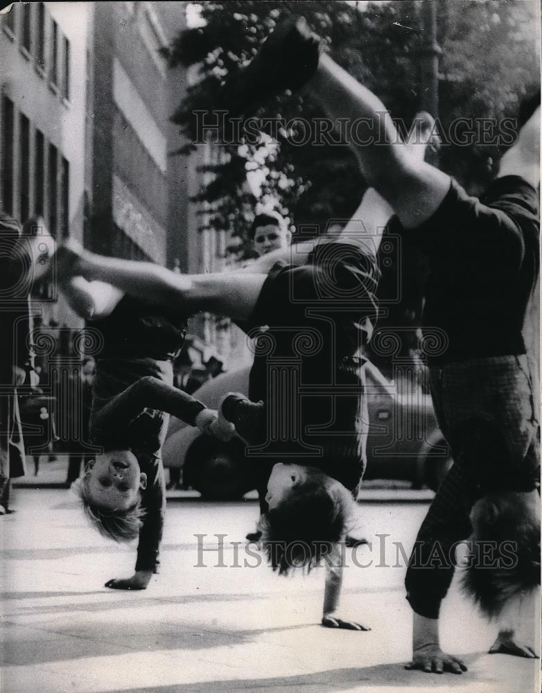 1966 Press Photo Three Young Boys Do Cartwheels During Summer In Germany - Historic Images