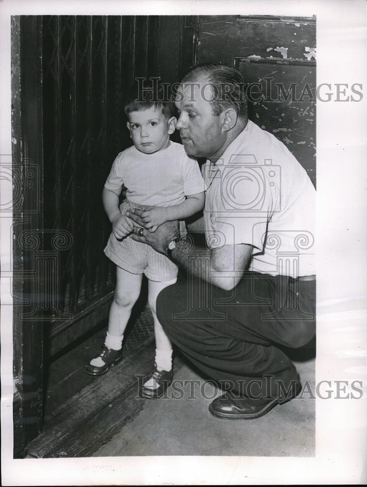 1956 Press Photo Eugene DeAngelis with Dad, Foot Trapped on Elevator - Historic Images