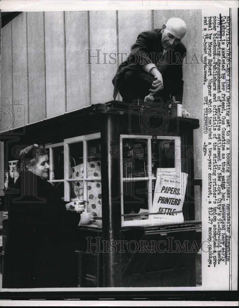 1963 Press Photo Newsdealer Josephine Calabro with friend painted her newstand. - Historic Images