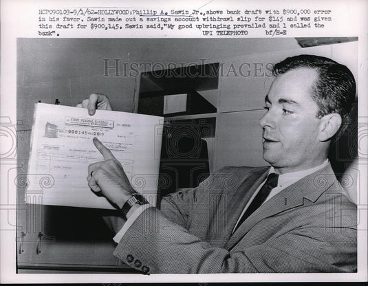 1962 Press Photo Philip A. Sawin Jr. show a bank draft with $900,000 error. - Historic Images