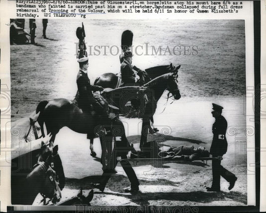 1960 Press Photo Bandman collapsed during rehearsal of Trooping of the Colour. - Historic Images