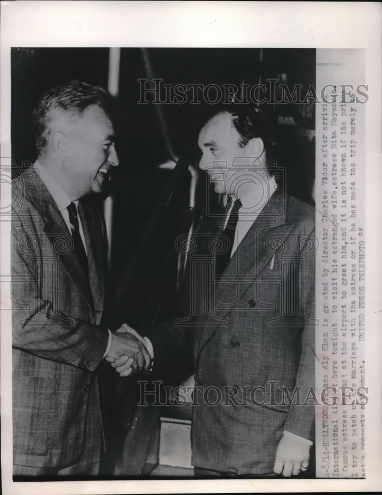 1952 Press Photo Prince Aly Khan greeted by Director Charles Vidor. - Historic Images