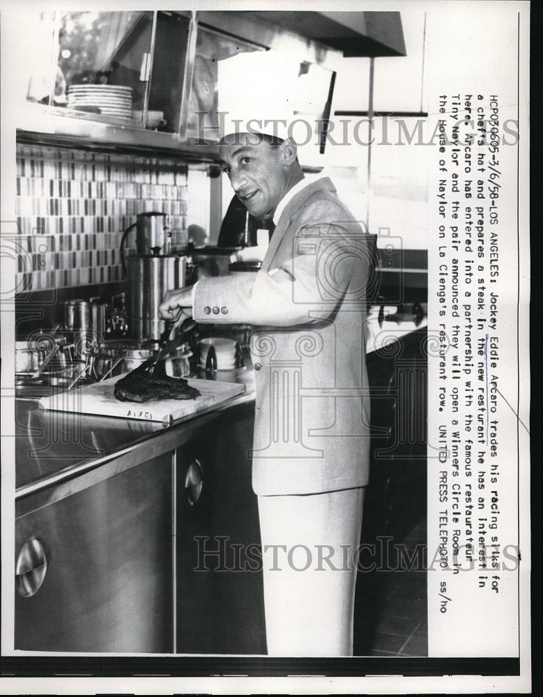 1958 Press Photo Jockey Eddie Arcaro trading in his racing hat for a cooks hat - Historic Images