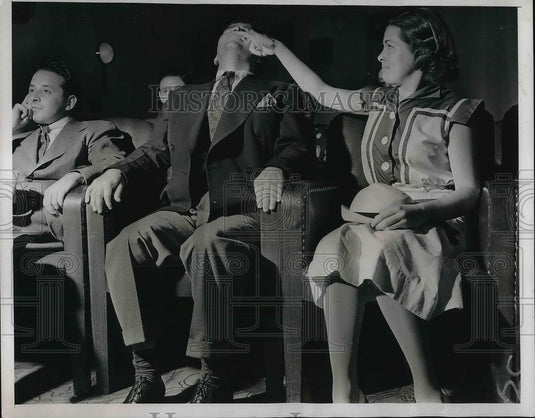 1938 Press Photo woman with finger under mans nose at a cinema - Historic Images